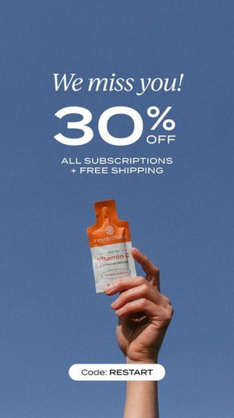 A minimalist, high-contrast ad creative featuring a hand holding a Vitamin C supplement packet against a solid blue background to promote a subscription discount.